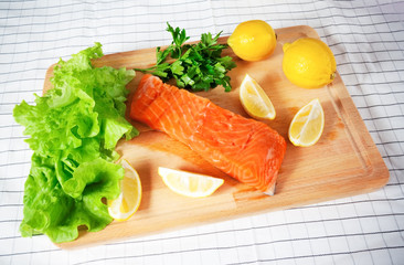 Fresh raw salmon on cutting board