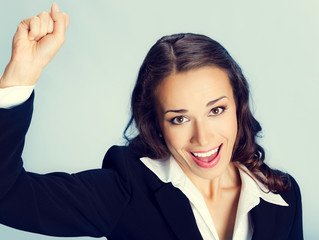 Fototapeta premium Happy gesturing business woman
