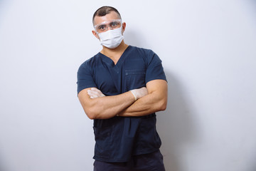 portrait of adult doctor in medical uniform on white background