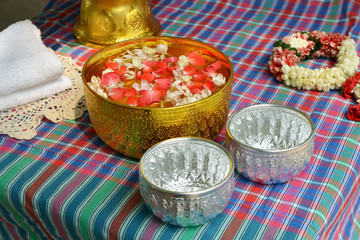 A Bowl with Water mixed with perfume and flower for Songkran Festival Thailand