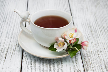 cup of tea with apple blossoms