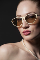 Portrait of Beautiful young woman in sunglasses