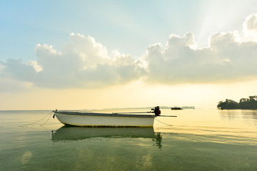 Canoe floating on the calm sea in morning