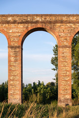 Ancient Italian Aqueduct in Evening Light