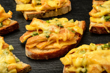 Sandwiches with fried eggs and cheese baked in oven.