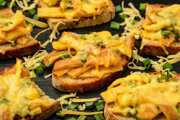 Sandwiches with fried eggs and cheese baked in oven.