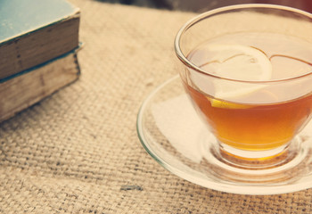 Hot lemon tea on table with soft light morning.
