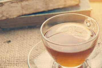 Hot lemon tea on table with soft light morning.
