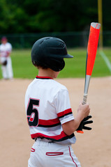 Close-up of american baseball boy from behind.