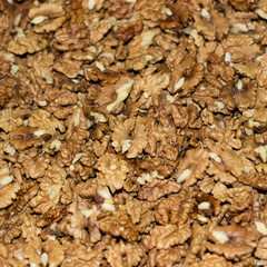 Heap of unshelled walnuts