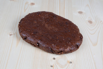 Chocolate cake fondants on  wooden table