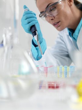 Researcher pipetting liquid