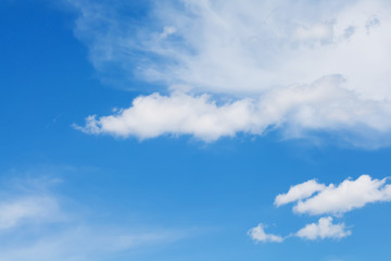 Fototapeta na wymiar Blue sky background with white clouds. Summertime landscape