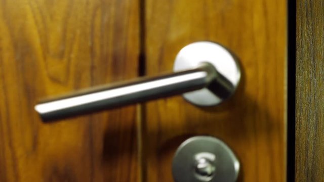 Businessman walks in and locks the toilet.