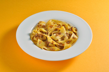 Dish with fettuccine with Bolognese sauce