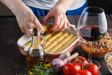 Woman making cannelloni