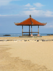 tradition beach pavilion at bali in sunny day.