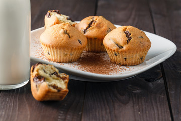 Breakfast with pastry and milk in bottle