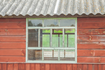 glassy window of cabin, tacky country old wooden small house