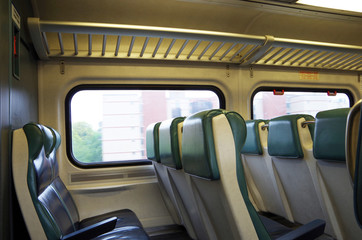 Fototapeta na wymiar View of commuter train seats passenger perspective