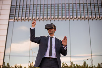 Businessman using virtual reality glasses