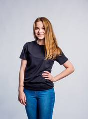 Girl in jeans and t-shirt, young woman, studio shot