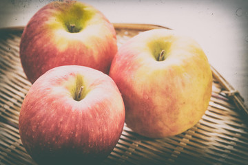 Red apple in basket