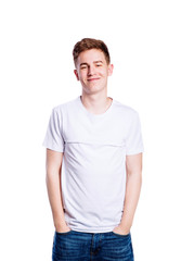 Fototapeta premium Boy in jeans and t-shirt, young man, studio shot