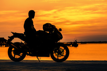 Obraz na płótnie Canvas Biker at sunset