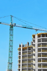 Crane and highrise construction site