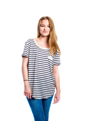 Fototapeta premium Girl in jeans and striped t-shirt, woman, studio shot