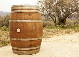 Wine barrel outside winery, with distant mountains in background