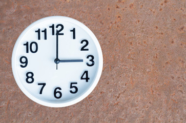 Clock on steel rusty background
