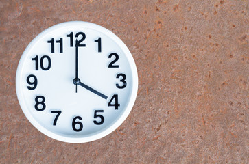 Clock on steel rusty background