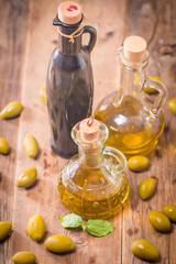 Olive oil and olives in bowl 