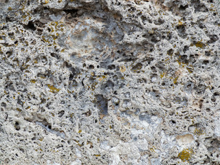 the texture of the stone, badly injured from the impact of time