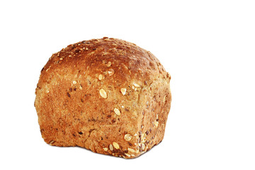 Loaf of brown whole grain bread with sunflower and sesame seeds isolated on white background