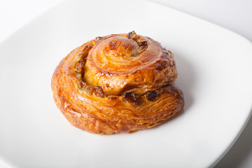 Baked roll on a plate
