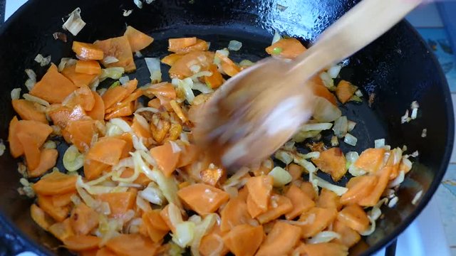preparation of frying onions and carrots in the pan/preparation of frying onions and carrots in the pan