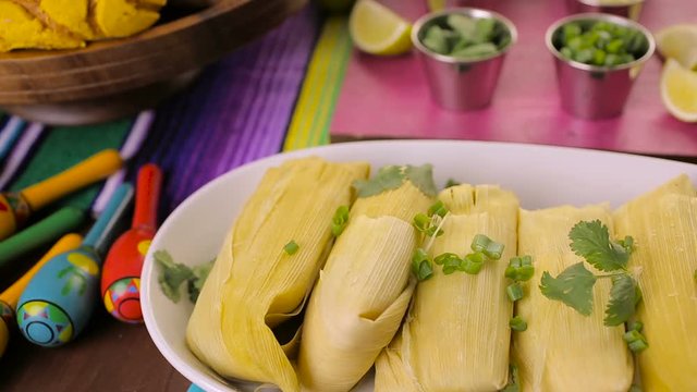 Party table with tamales, strawberry margaritas and pan dulche bread