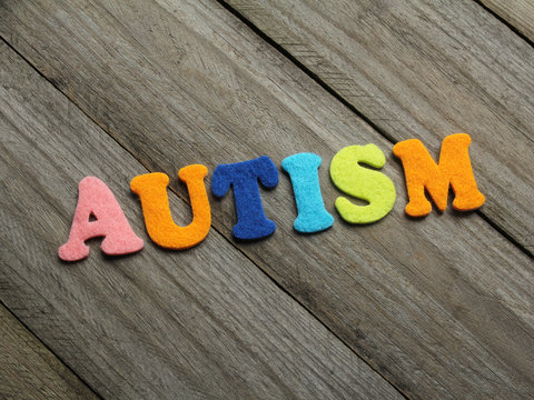 autism text on wooden background