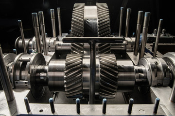 A part of a small steam turbine. Metal gears. Gear wheels of the engine. © Anton Mikhmel