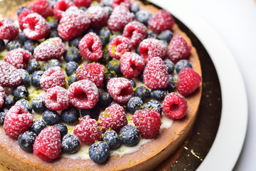 cake with raspberries and blueberries