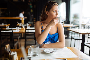 Beautiful woman enjoying her coffee