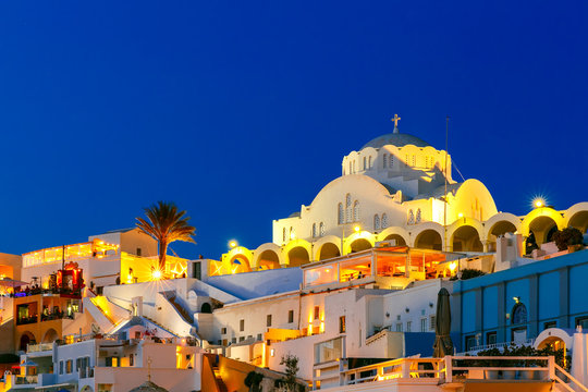 Orthodox Metropolitan Cathedral of Fira, modern capital of the Greek Aegean island, Santorini, during twilight blue hour, Greece
