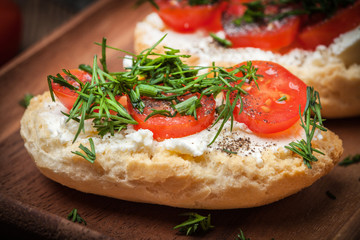 Delicious bruschetta with tomatoes, feta cheese, dill and spice