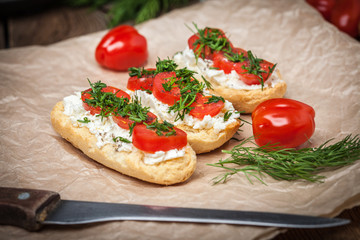 Delicious bruschetta with tomatoes, feta cheese, dill and spice