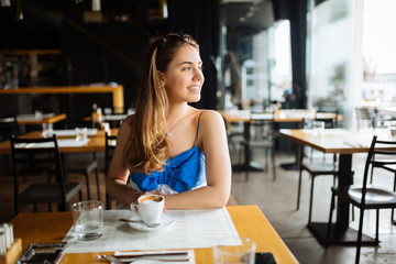 Stunning woman enjoying her coffee