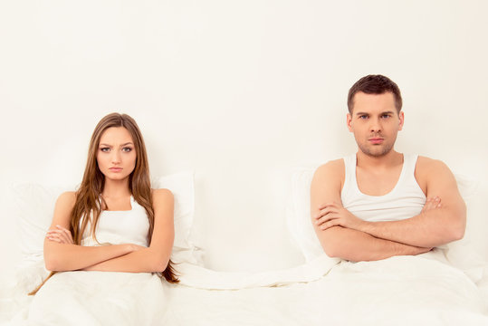 Upset angry man and woman having marital problems