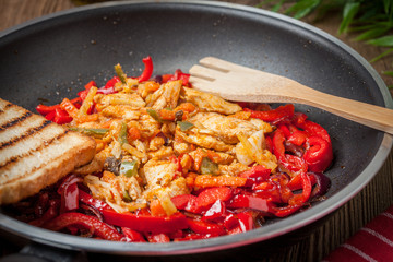 Fried chicken pieces with vegetables.